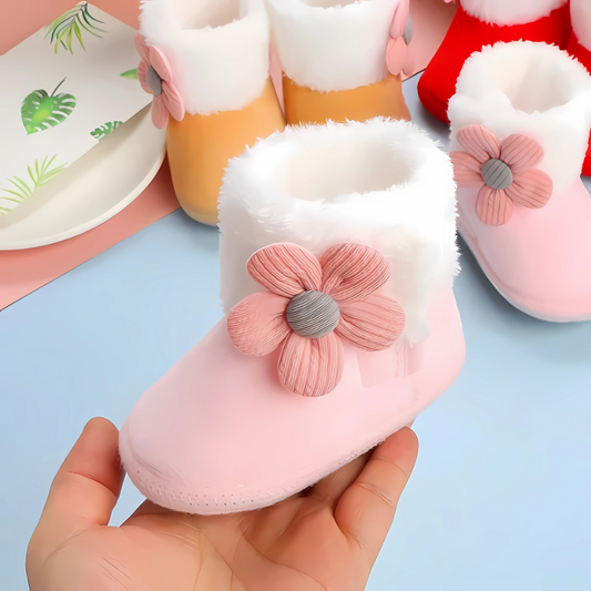 Warm, soft, non-slip unisex baby booties in plush white, perfect for infant comfort and safety.