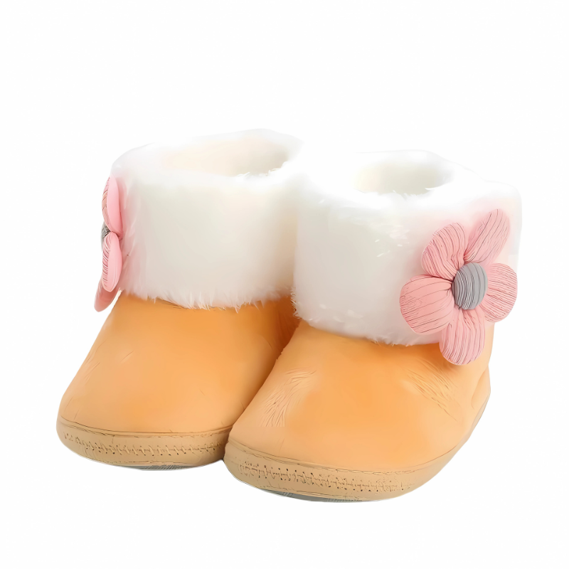 Pair of cozy blue unisex baby indoor booties, featuring a non-slip sole for safe toddler steps.