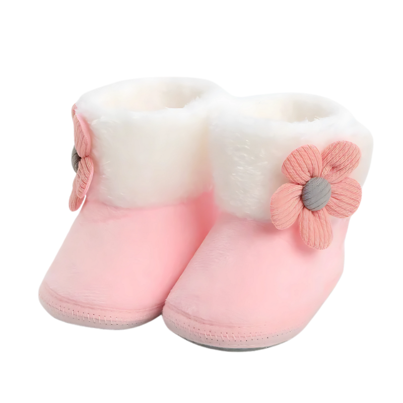 Soft pink unisex baby booties, warm and non-slip, designed for ultimate infant and toddler comfort indoors.