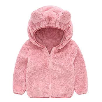 Close-up of the plush texture on a girls' pink hooded winter jacket, soft feel.