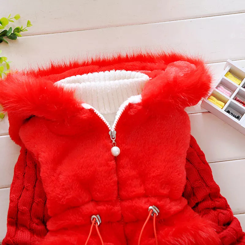 Toddler girl's pink plush-lined hooded winter jacket, perfect for warmth and comfort.