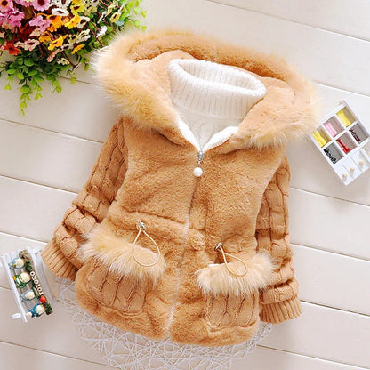 Toddler jacket, plush and warm, featuring a secure zipper closure and protective hood.