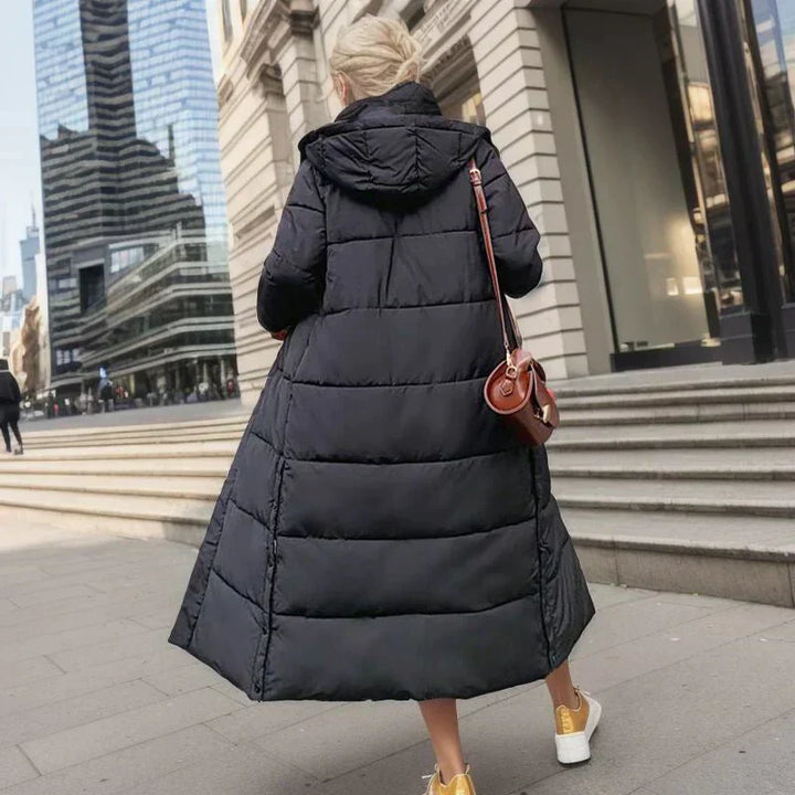 Women's long winter coat, a stylish choice for cold weather activities.