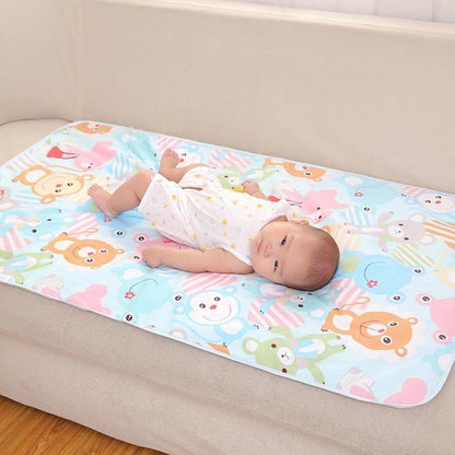 Foldable baby changing mat with cute animal print, ideal for infant care.