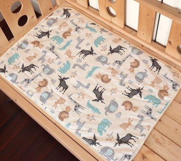 Portable diaper changing mat for on-the-go parents, gray pattern.