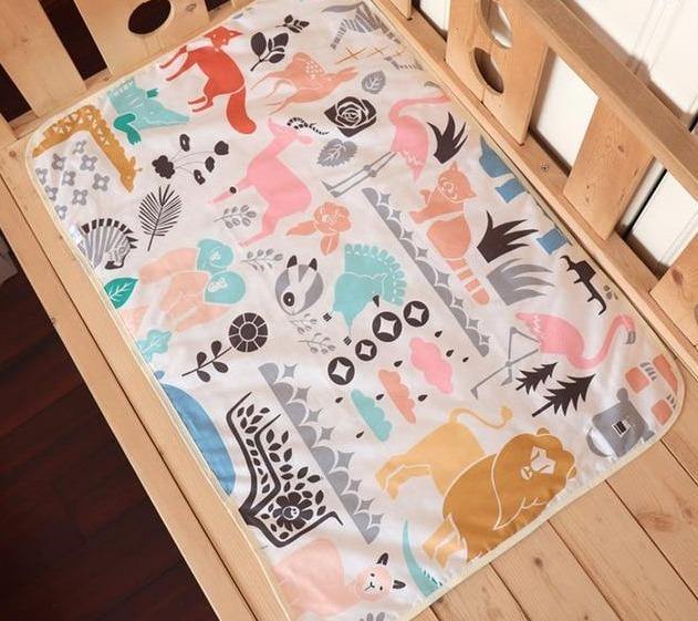 Waterproof baby changing pad with soft surface, for home or travel.