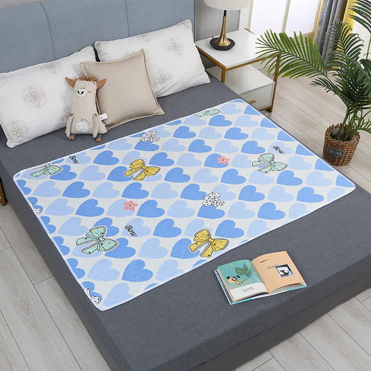 Waterproof washable mattress pad for baby crib, protects against urine, reusable.