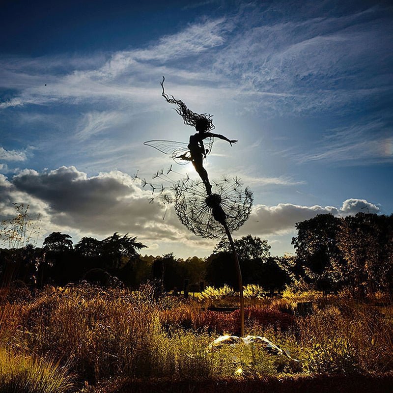 Decorative metal fairy garden statue, whimsical design with dancing pose & dandelion. Outdoor yard art.