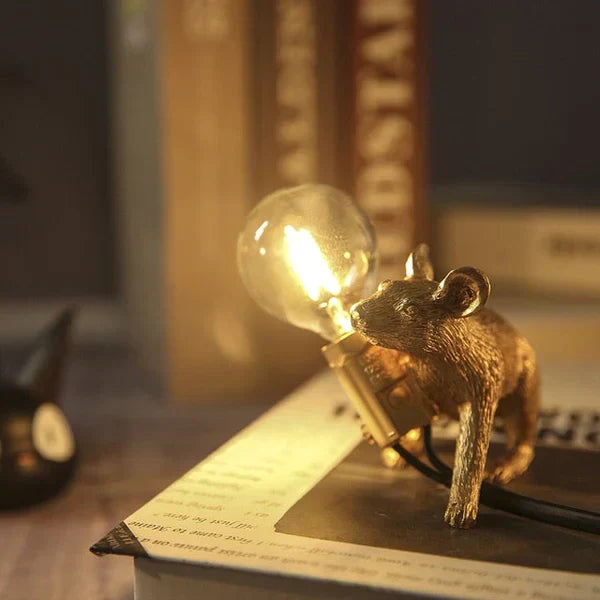 Decorative mouse lamp in gold, bringing a playful and unique touch to any living room or bedroom.