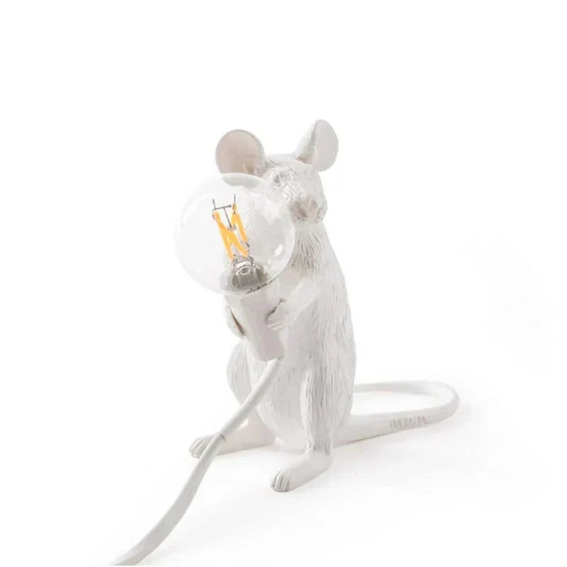 Elegant white mouse lamp, a novelty animal decor piece providing soft, whimsical lighting.