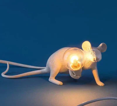 Whimsical gold mouse lamp, a stylish home accent and novelty light for modern or classic interiors.
