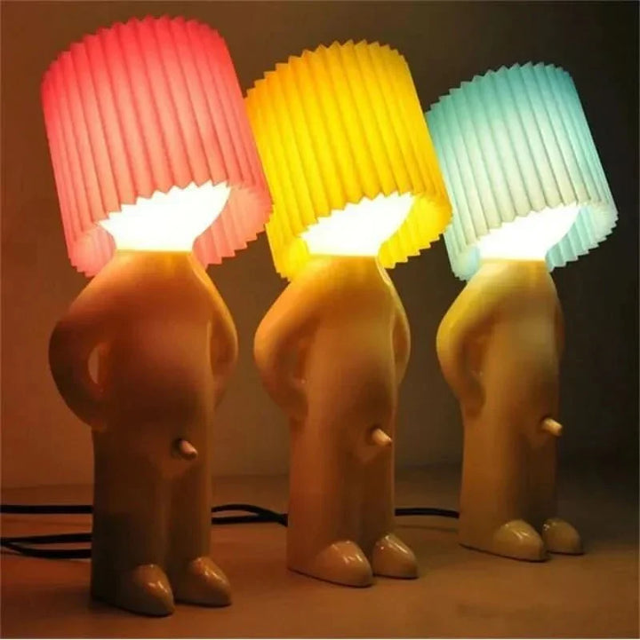 Playful LED table lamp; creates lively ambiance, energy-efficient decorative lighting for home.