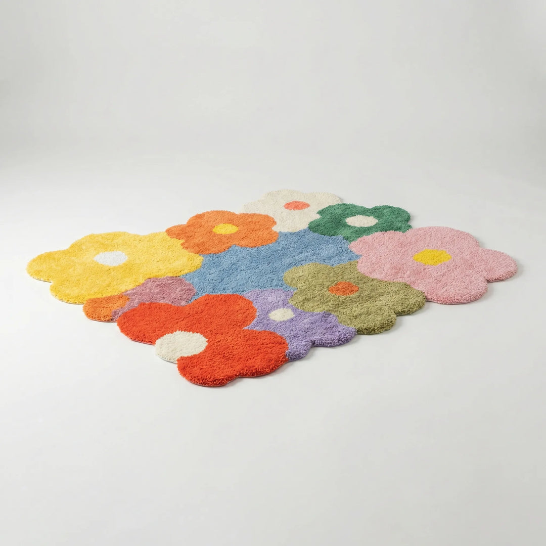 Soft Flowique floral area rug with a whimsical meadow design and wavy scalloped edges, ideal for home decor.