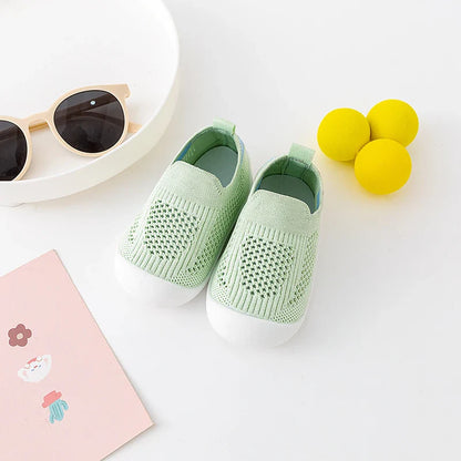 Side profile of pink baby breathable mesh shoes with a soft, flexible sole