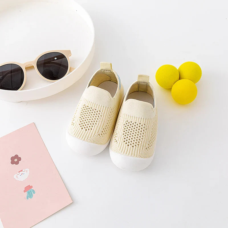 Light blue baby spring sneakers made from breathable mesh, comfort for growing feet
