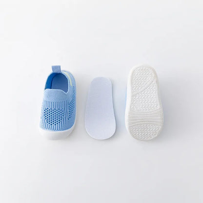 Back view of navy blue baby slip-on mesh sneakers, with pull tab for easy dressing