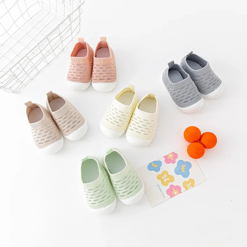 Baby's foot slipping into a breathable mesh sneaker, demonstrating ease of use