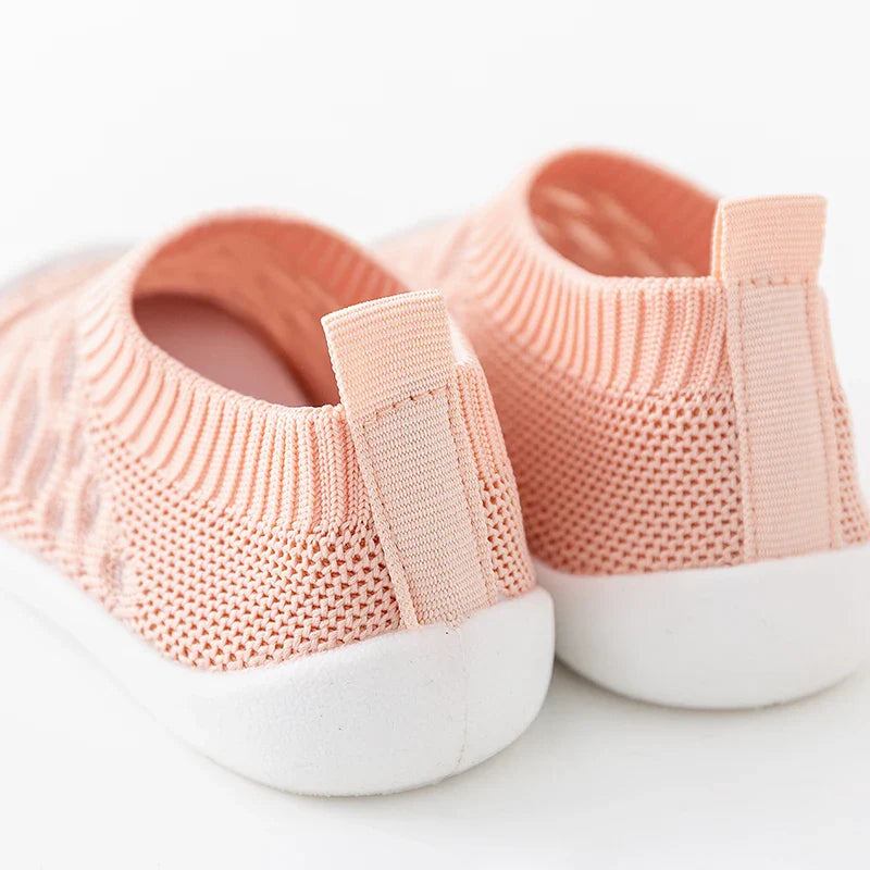 Close-up of the stitching on baby mesh sneakers, durable and breathable construction