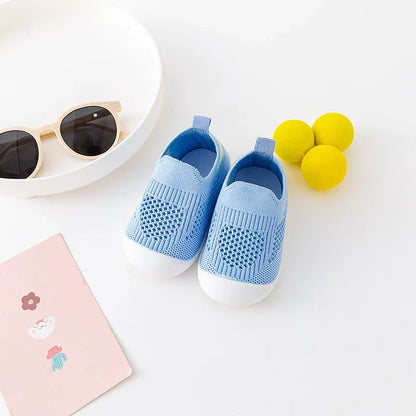 Top view of grey baby slip-on mesh shoes, showing elastic opening for easy wear