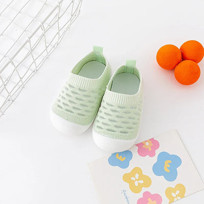 Pair of yellow toddler breathable sneakers, perfect for warm weather adventures