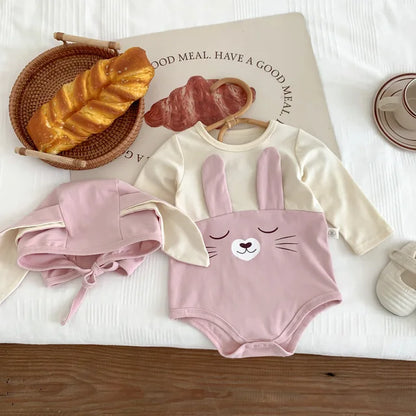 Simple white baby cotton bodysuit onesie with cap, a versatile and breathable newborn outfit.