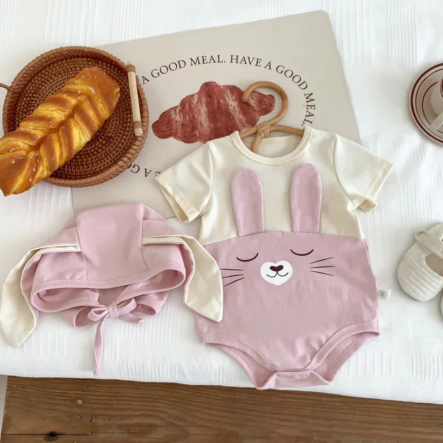 Baby gift set: white cotton bodysuit onesie with cap, ideal for newborn essentials.