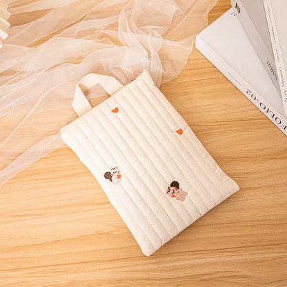 White baby cotton diaper bag, neatly packed with baby clothes and a bottle, parenting essential