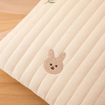 Baby cotton embroidered diaper bag on a nursery changing table, ready for use, parenting essential