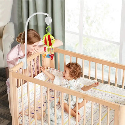 Adjustable baby crib mobile arm with a music box and a tight, safe clamp mechanism