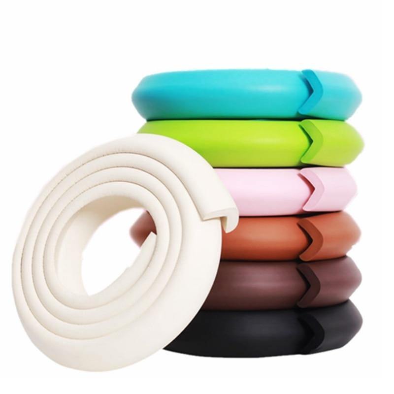 White baby safety corner guard foam edge protector on furniture, child proofing home safety bumper strip