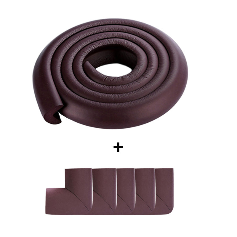 Grey baby safety foam edge protector on a fireplace hearth, showing secure child proofing