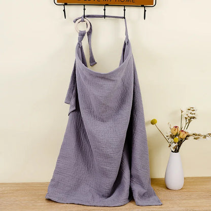 White cotton muslin nursing cover featuring a simple, clean design for new moms.
