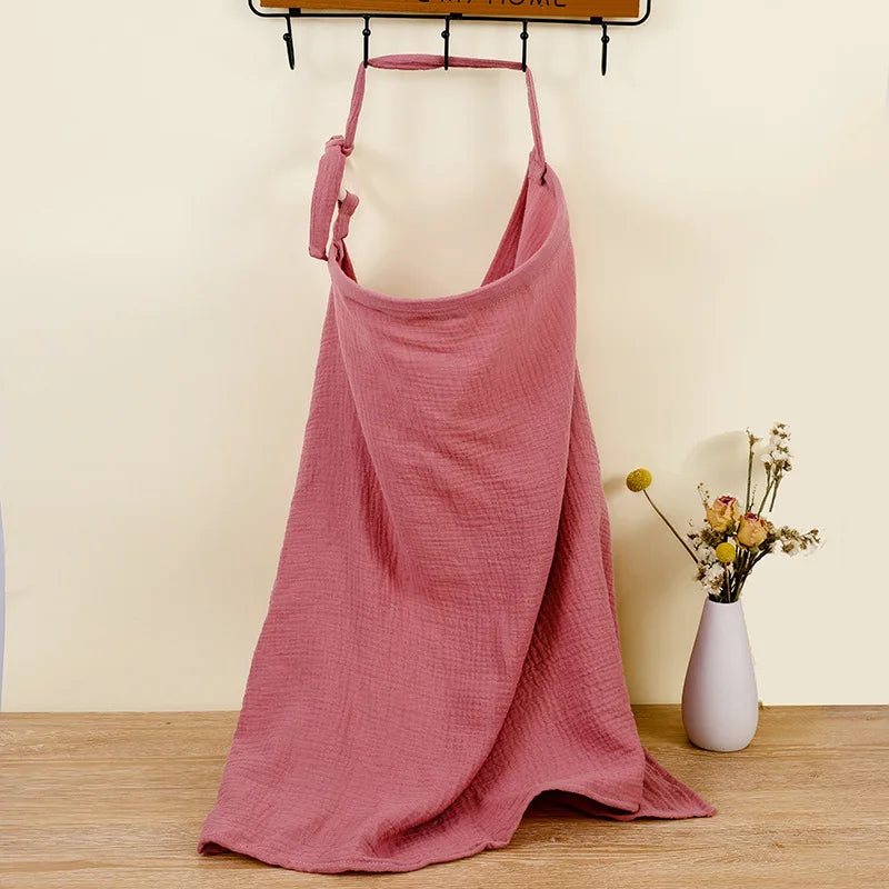 Versatile white cotton muslin cover draped over a car seat, baby accessory.