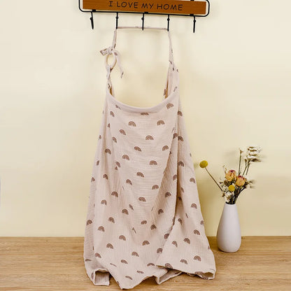 Multi-use white cotton muslin blanket for nursing and stroller, essential for new parents.
