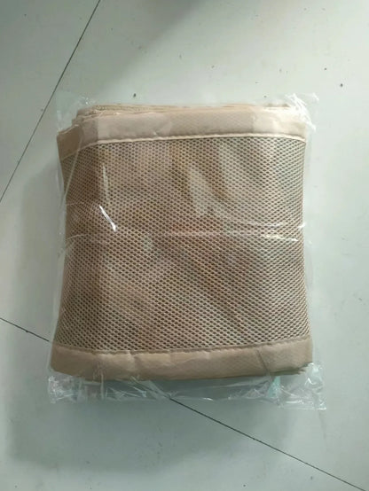 Infant sleeping peacefully in a crib with a breathable mesh bumper for safety