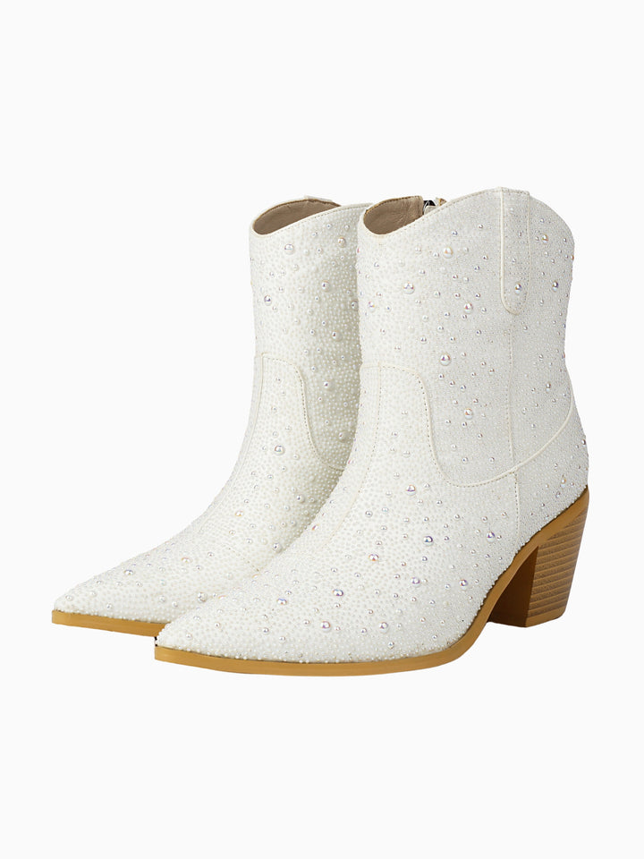 White bridal cowgirl boots for women, adorned with elegant pearl & rhinestone details, perfect for a western wedding.