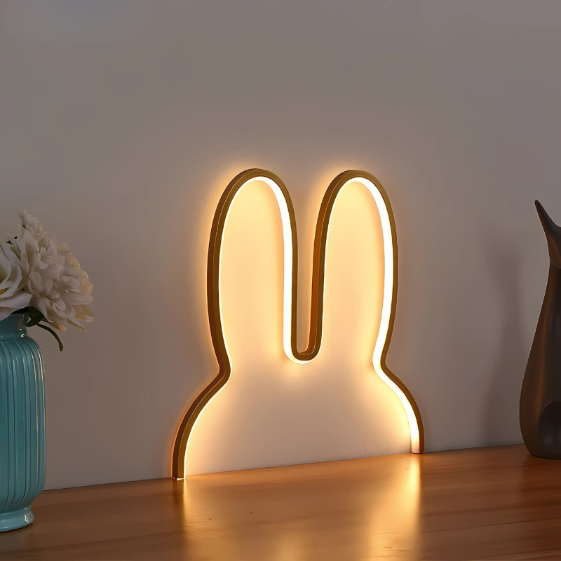 White bunny-shaped night light, USB rechargeable, perfect for kids rooms or nursery decor, providing soft sleep aid lighting