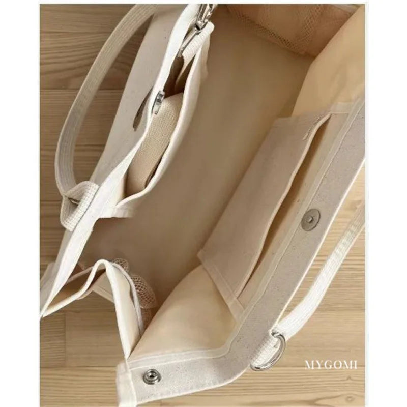 Close-up of the durable white canvas fabric of the baby diaper bag organizer.