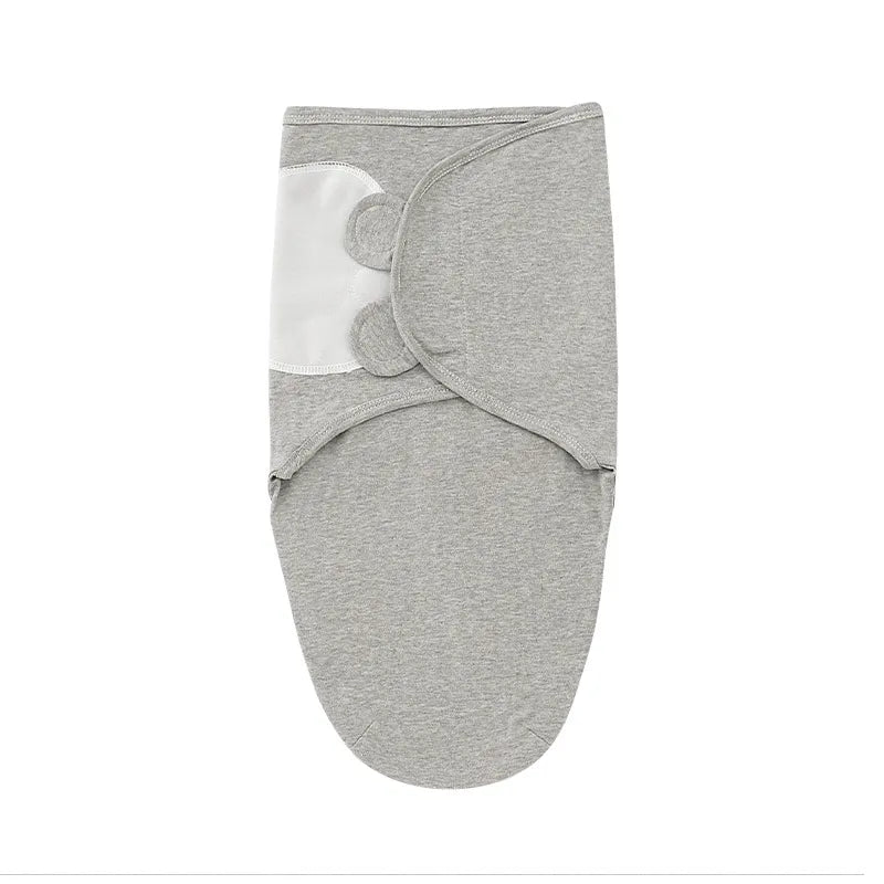 Photo of a folded cotton baby swaddle blanket and hat set, ready for gifting
