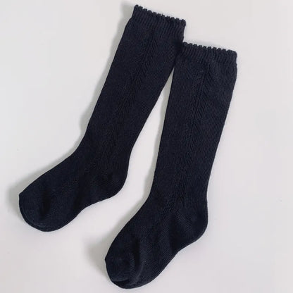 Soft green knee-high socks, breathable cotton, gentle on skin, ideal for baby accessories