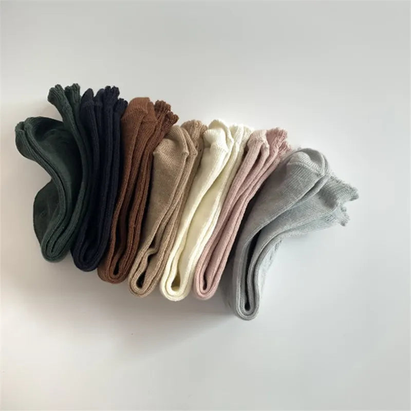 Comfortable cotton knee-high socks with reinforced toe for durable kids' wear