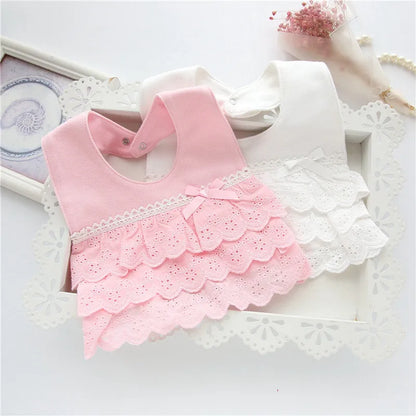 Pink cotton lace baby bib for girls with intricate lace details, perfect for stylish infant feeding and drool protection.