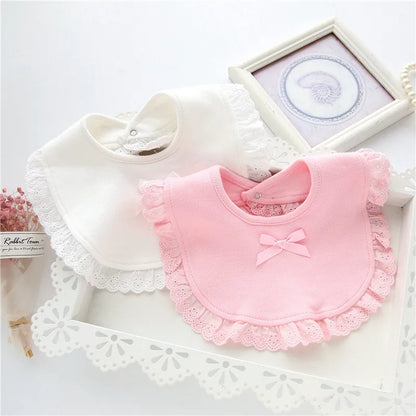Set of three girls' cotton lace baby bibs in white, pink, and ivory, offering adorable protection for newborns.