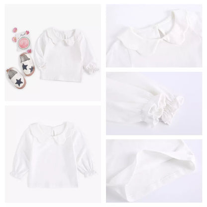 White cotton baby girl top with a small decorative detail, spring summer ready