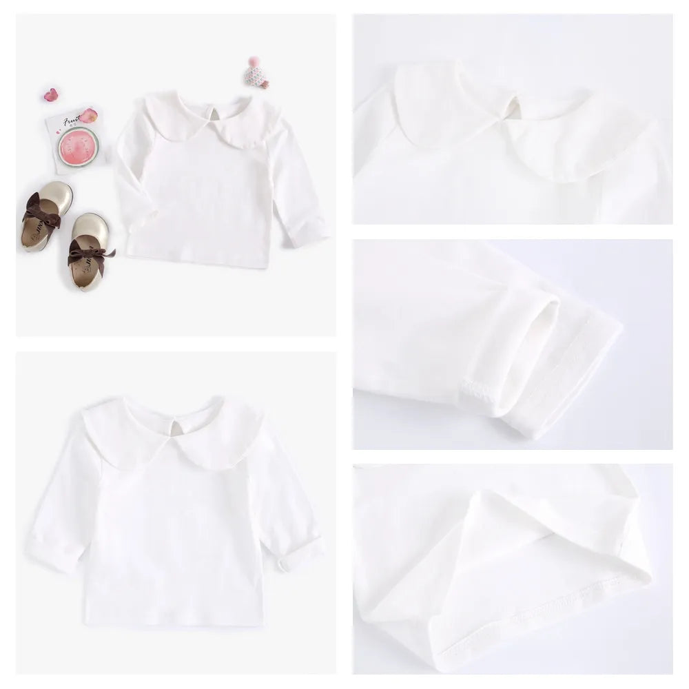 White cotton short sleeve top for baby girls paired with a colorful bottom