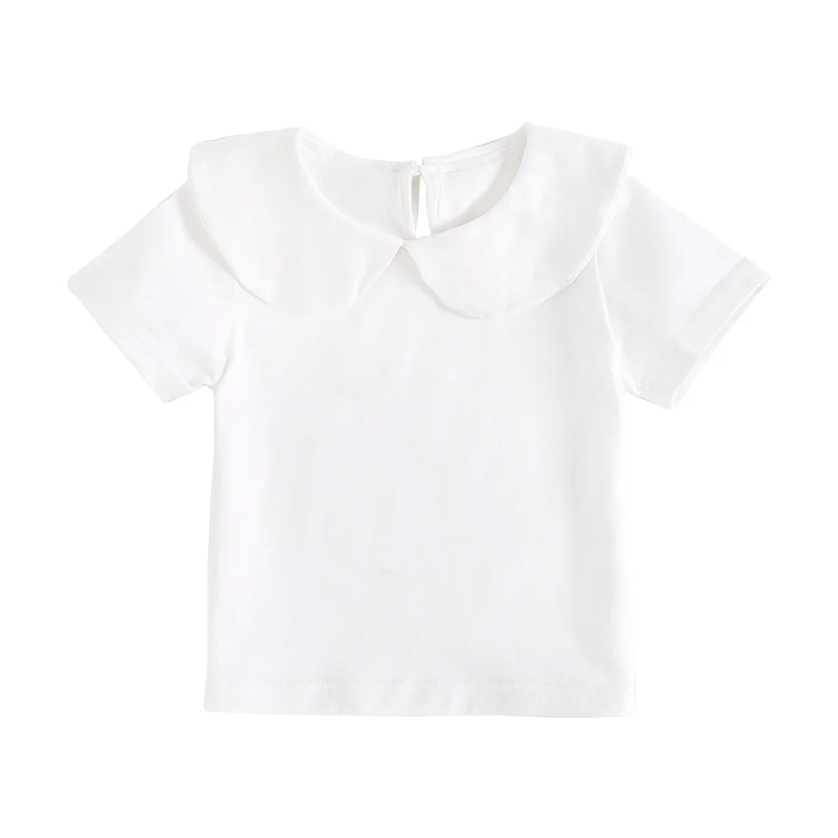 Detailed fabric texture of a white cotton fashion top for toddlers, soft and breathable