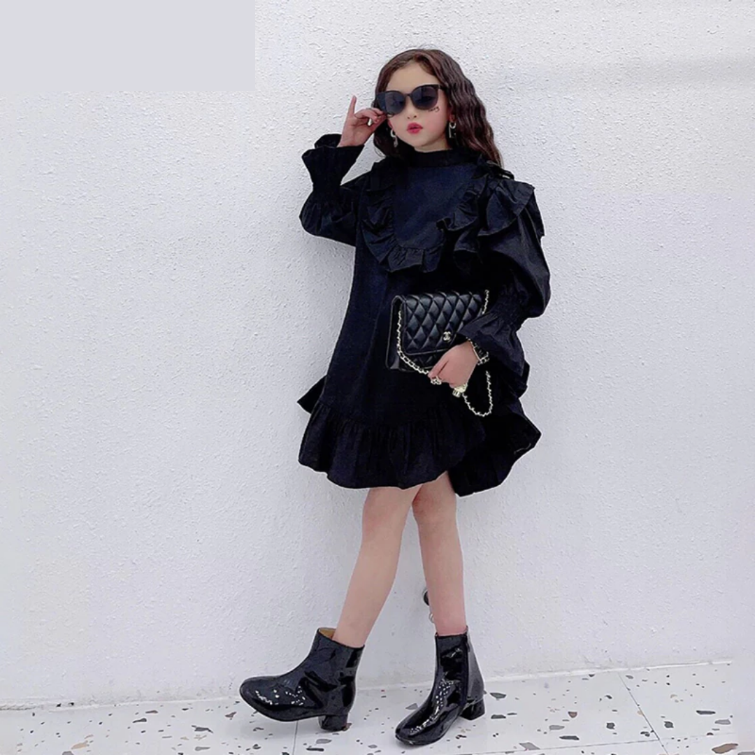 Stylish girls' special occasion dress with elegant ruffles & comfy ruched cuffs. Kids' cotton blend formal wear.