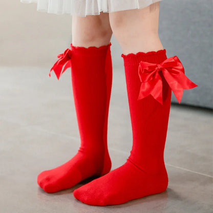 Soft gray cotton blend knee-high socks for girls, big sparkly bow, winter fashion accessory.