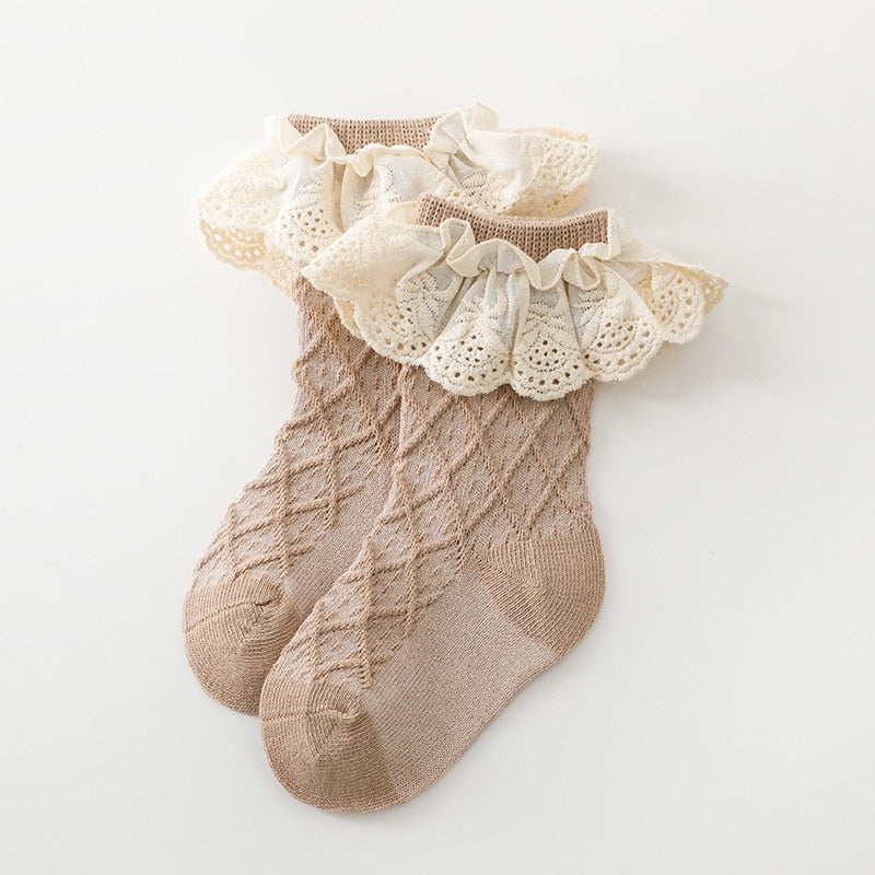 Close-up of pink lace flower tube socks for girls, ribbed cotton, princess style