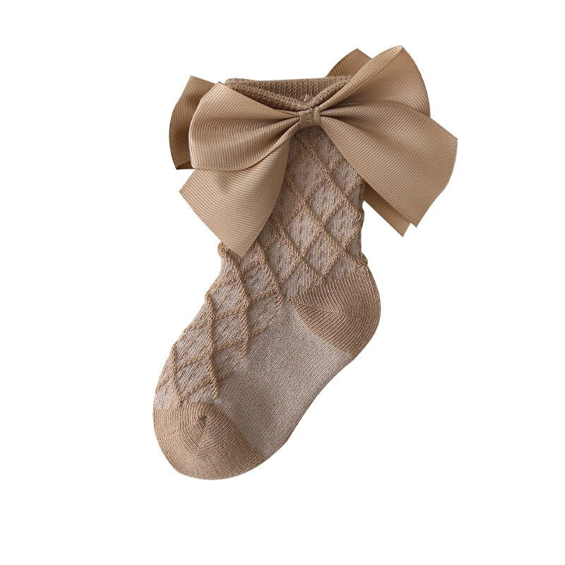 Girl wearing white lace flower long tube socks, soft ribbed cotton, princess look